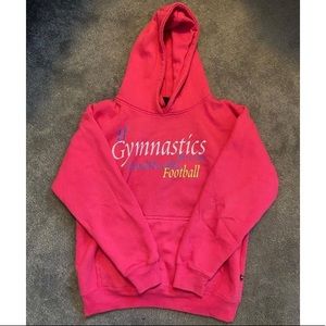 Pink gymnastics sweatshirt.